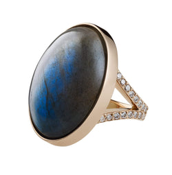 labradorite ring with an oval center cabochon stone set in an 18k gold mounting.